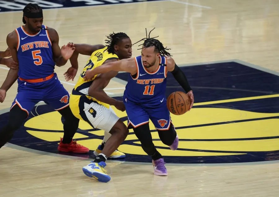 May 27, 2025; Indianapolis, Indiana, USA; New York Knicks guard Jalen Brunson (11) drives to the hoop past Indiana Pacers forward Aaron Nesmith (23) during the first quarter of game four of the eastern conference finals for the 2025 NBA Playoffs at Gainbridge Fieldhouse. Mandatory Credit: Trevor Ruszkowski-Imagn Images