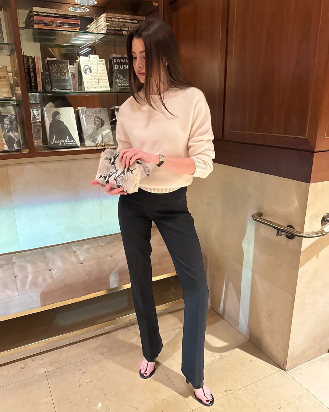 Anna Porte wearing skinny pants with thong heels