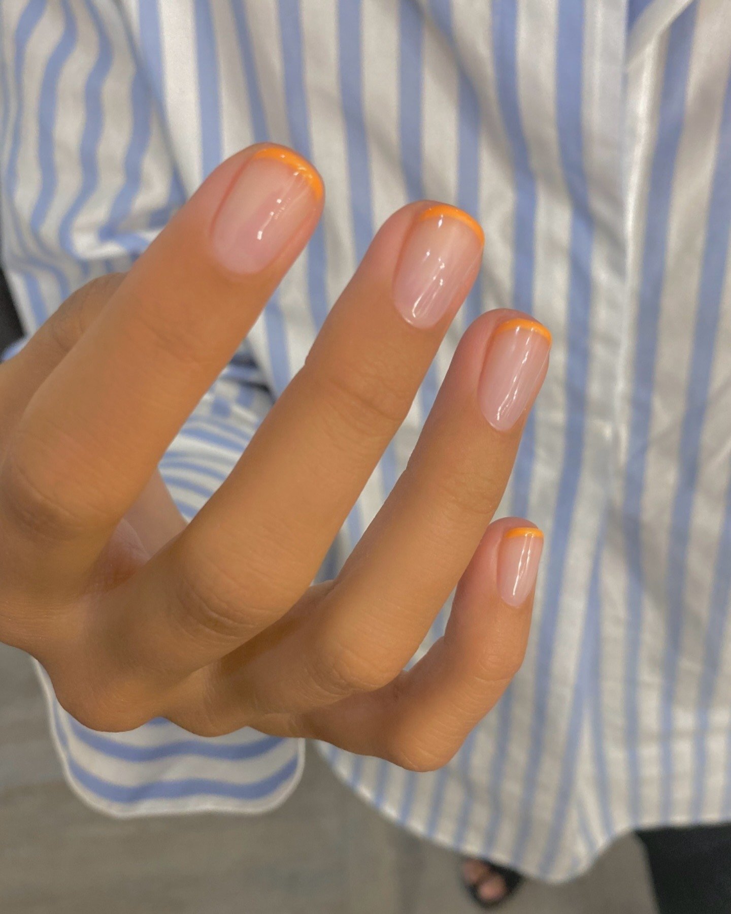 Short Squoval nails with orange French manicure