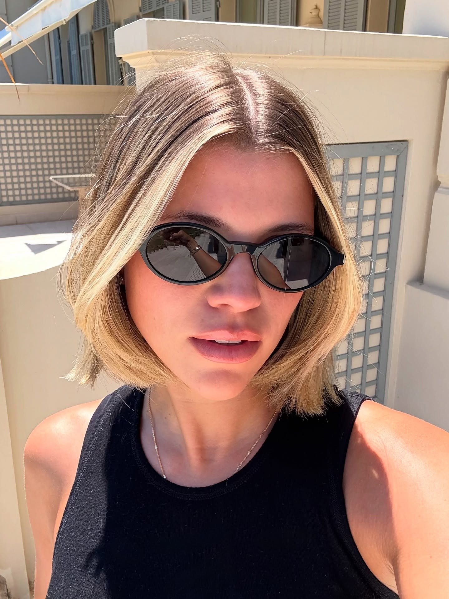 Sofia Grainge taking a selfie in France with a new bob hairstyle