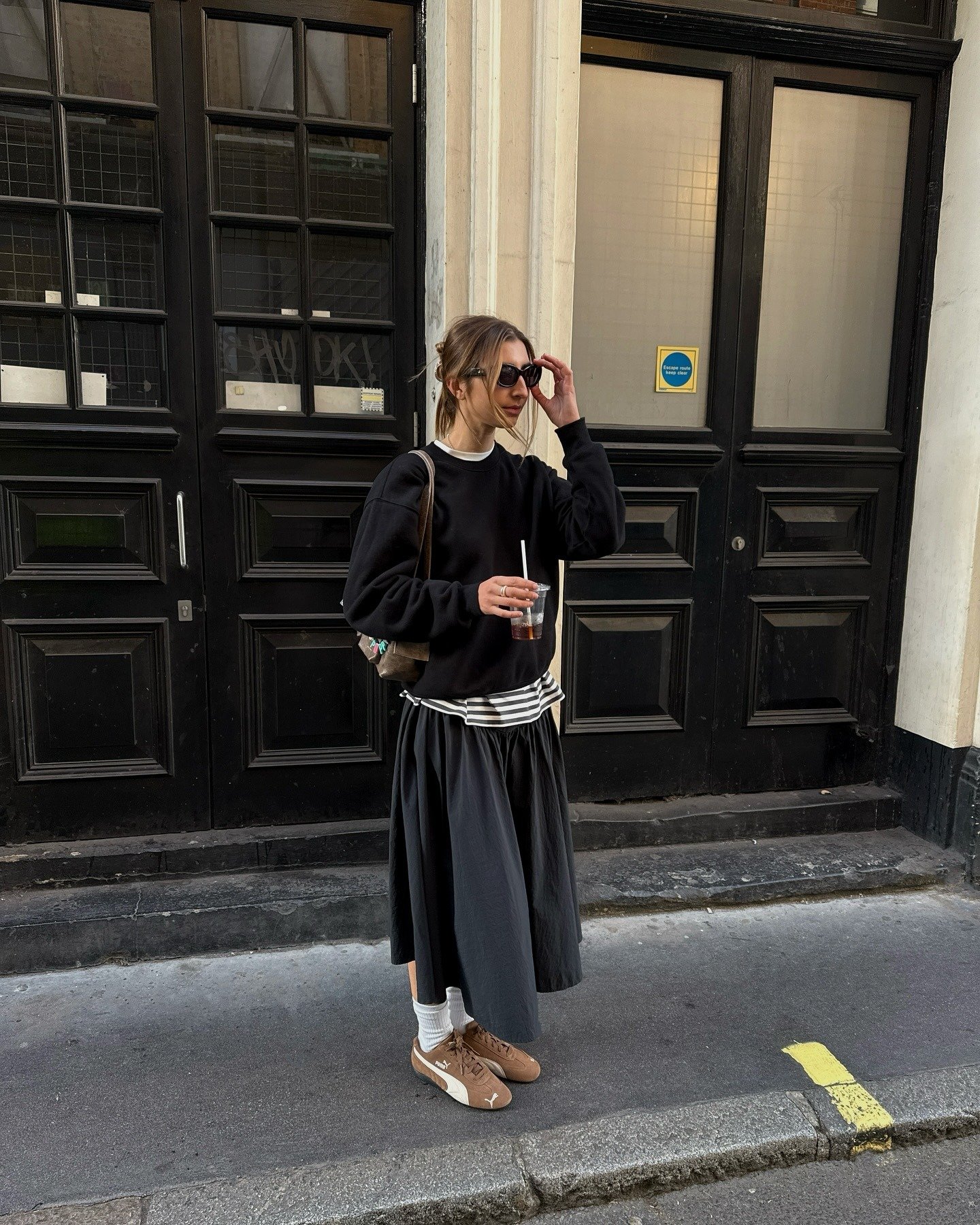 Poppy Almond wears a Puma Speedcat OG trainers outfit.