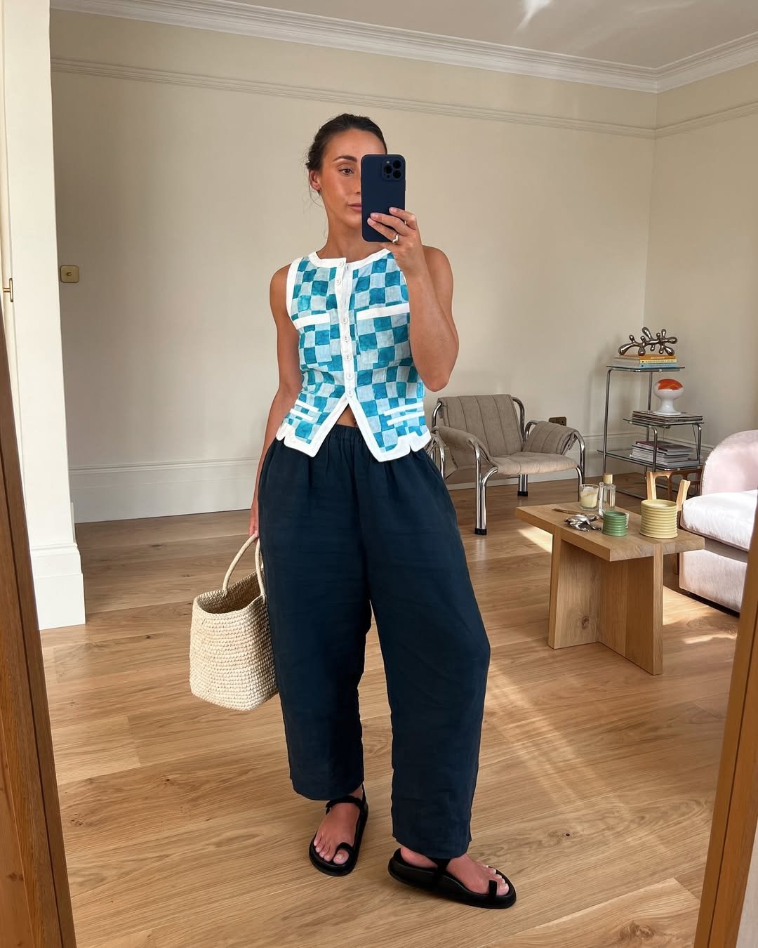 @emswells wears navy linen trousers