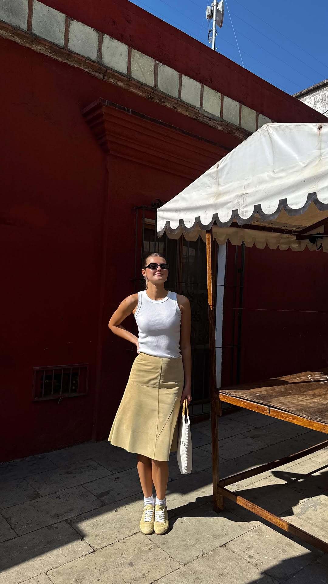 Influencer wears butter yellow trainers.