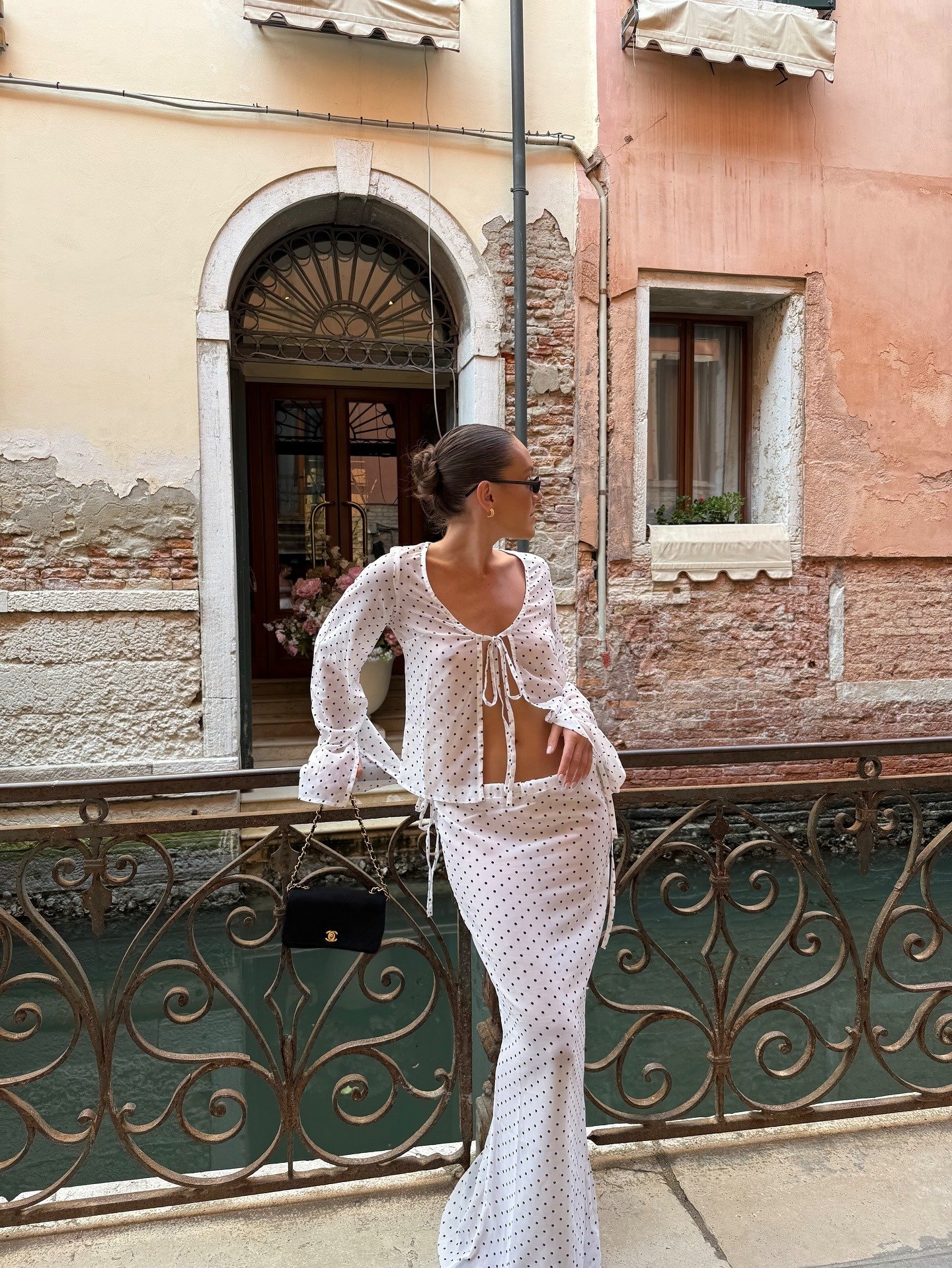 Photo of influencer wearing two-piece skirt set in the summer.