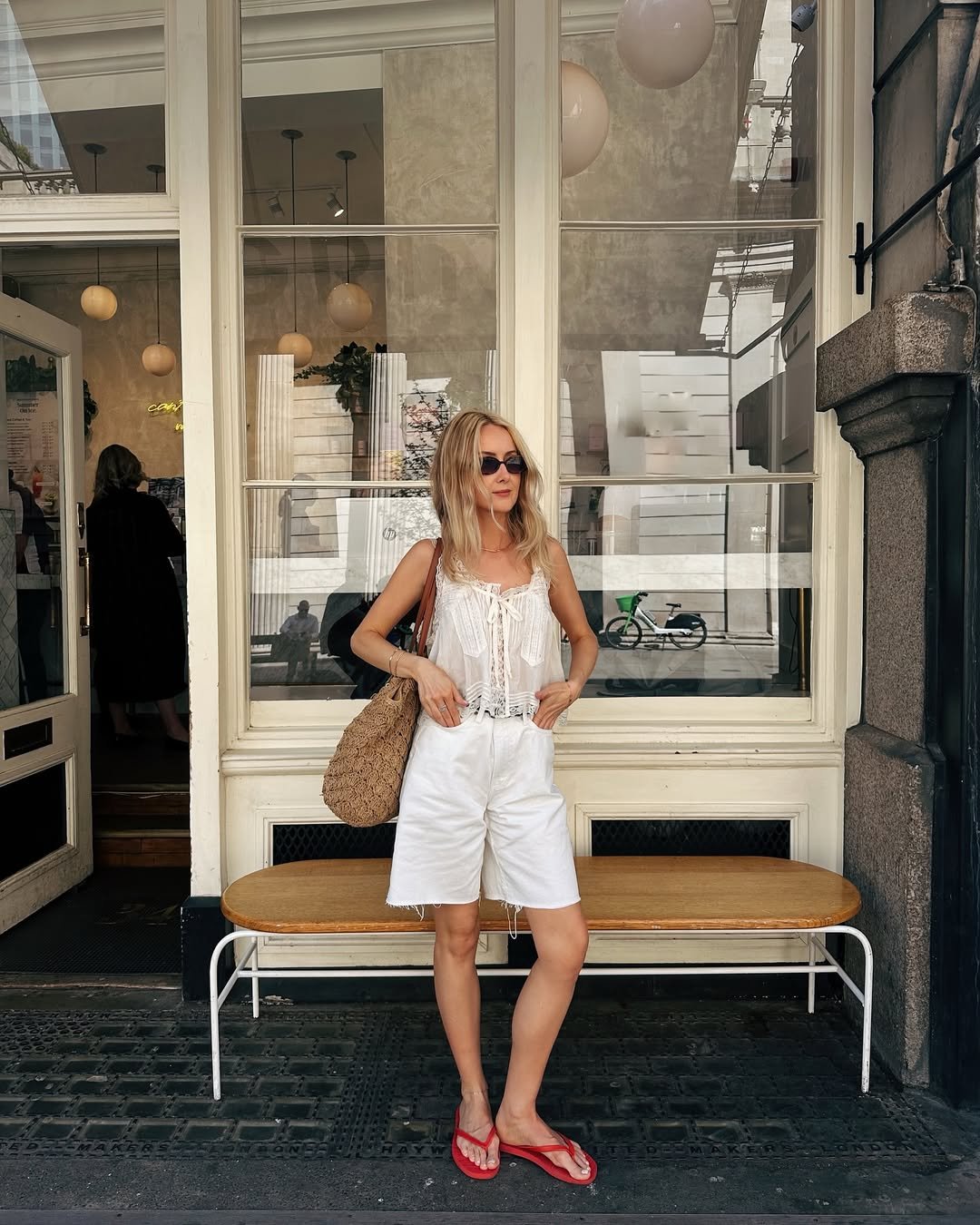 Chloe wearing cami top and shorts