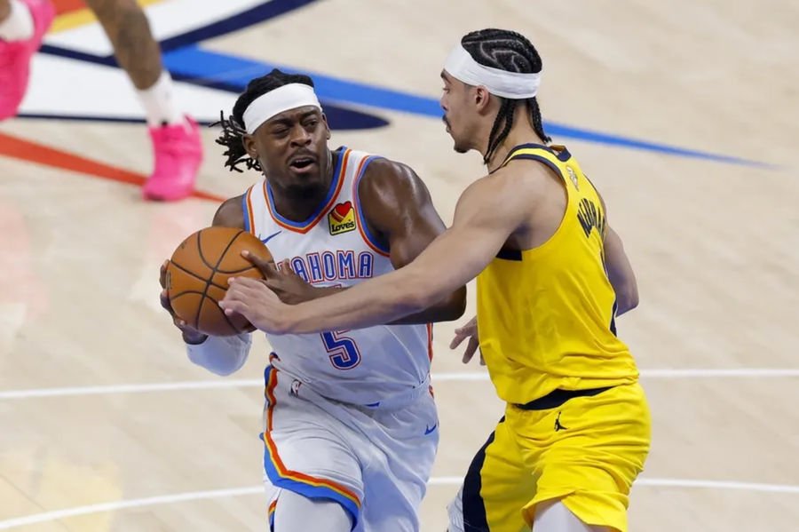 Jun 16, 2025; Oklahoma City, Oklahoma, USA; Oklahoma City Thunder guard Luguentz Dort (5) drives to the basket past Indiana Pacers guard Andrew Nembhard (2) during the second quarter in game five of the 2025 NBA Finals at Paycom Center. Mandatory Credit: Alonzo Adams-Imagn Images