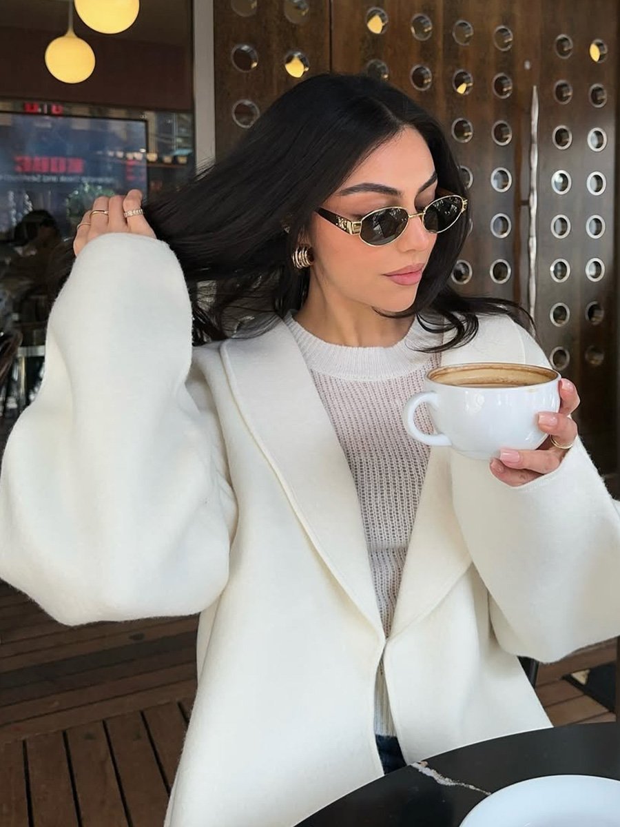 Mobina Peiman drinks tea with ultra-glossy black strands.