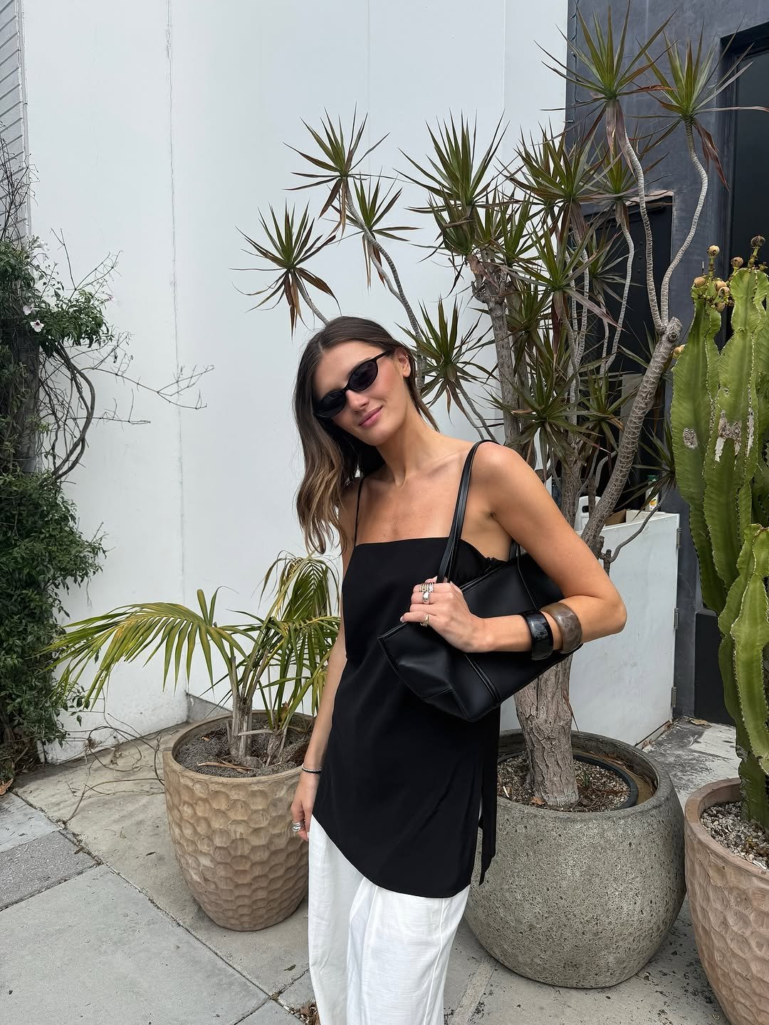 Woman wearing bangle bracelets jewelry trend 2025.