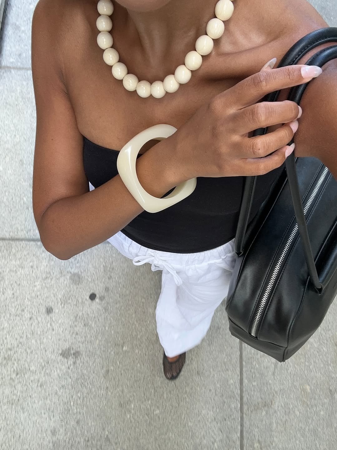 Woman wearing bangle bracelets jewelry trend 2025.