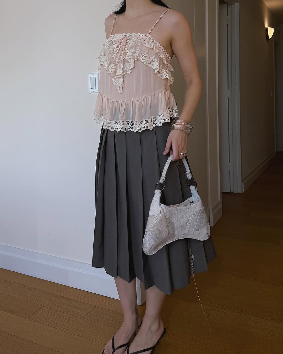 Woman wearing bangle bracelets jewelry trend 2025.