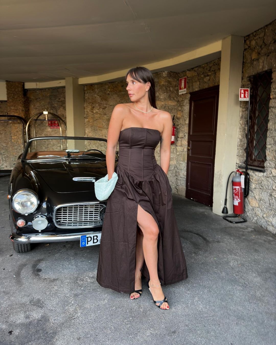@piabaroncini wearing a brown gown