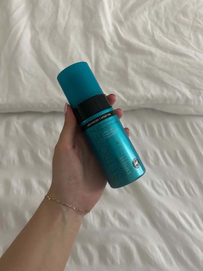 Junior beauty editor Grace Lindsay holding the St. Tropez express fake tan