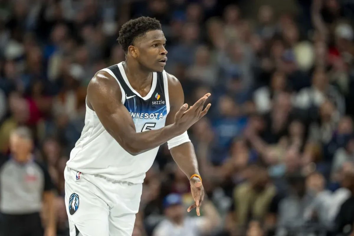 Mar 9, 2025; Minneapolis, Minnesota, USA; Minnesota Timberwolves guard Anthony Edwards (5) holds his hand up celebrating making a three point shot against the San Antonio Spurs in the first half at Target Center.