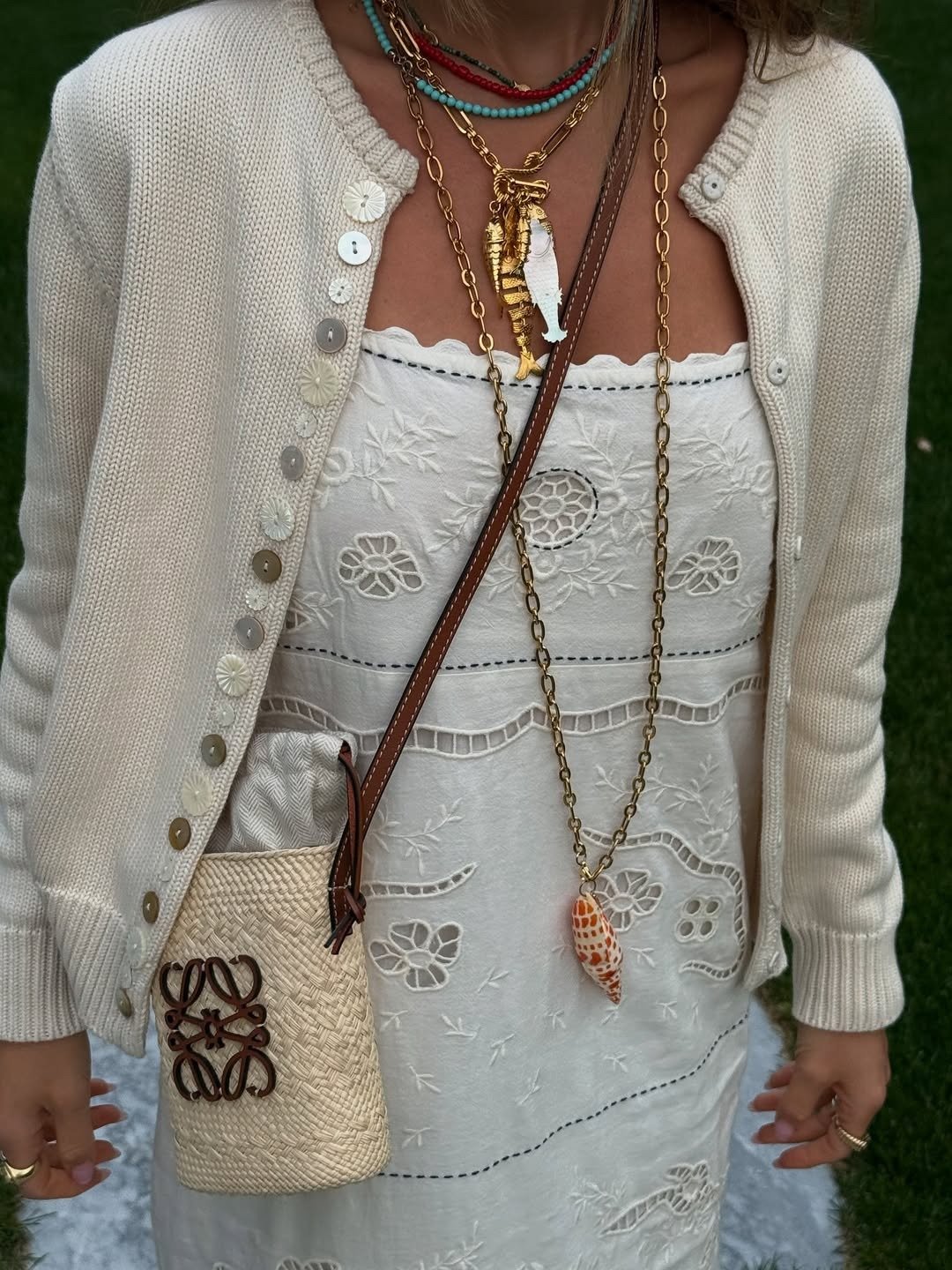 Woman in white dress and ocean-inspired jewelry