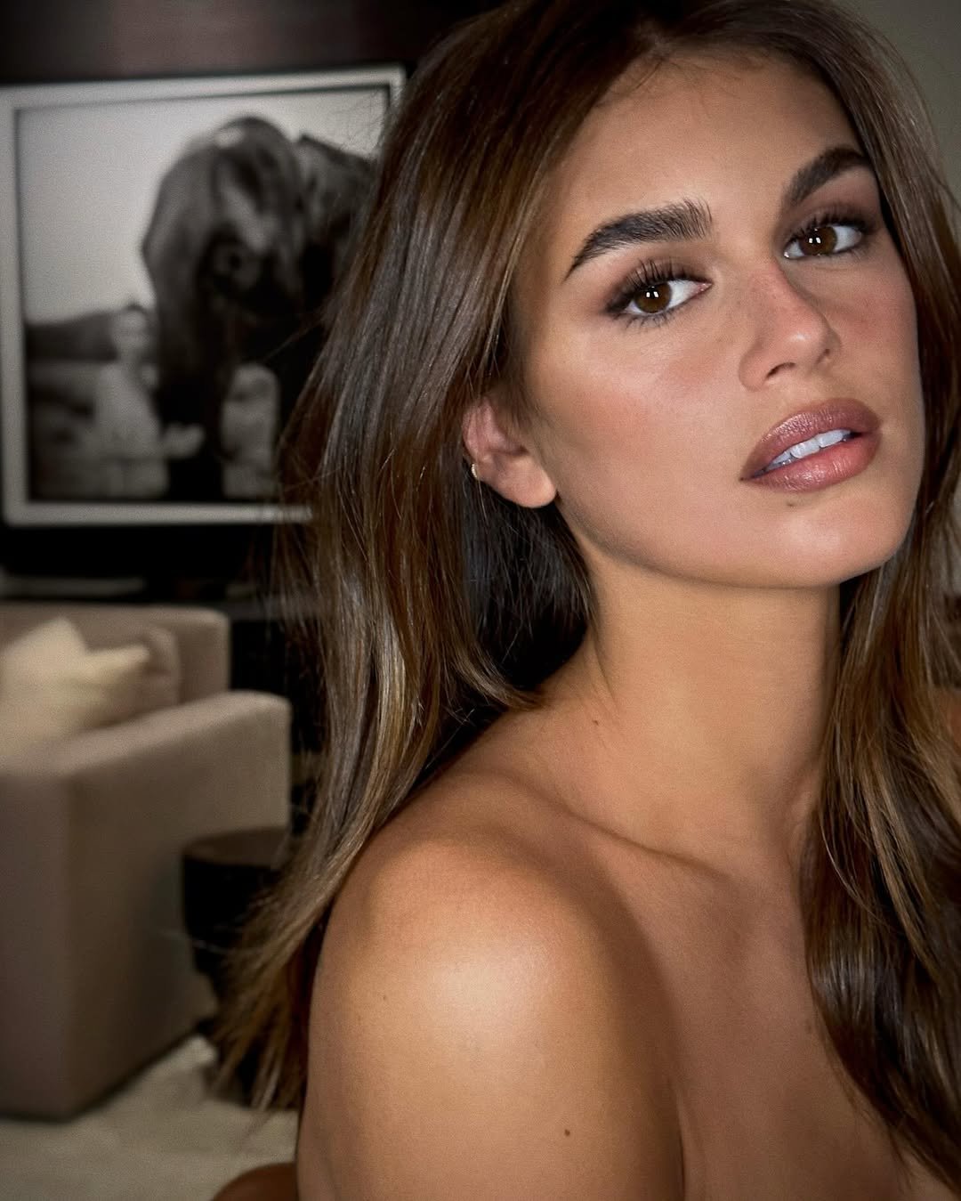 Kaia Gerber poses with glossy, ash brown hair
