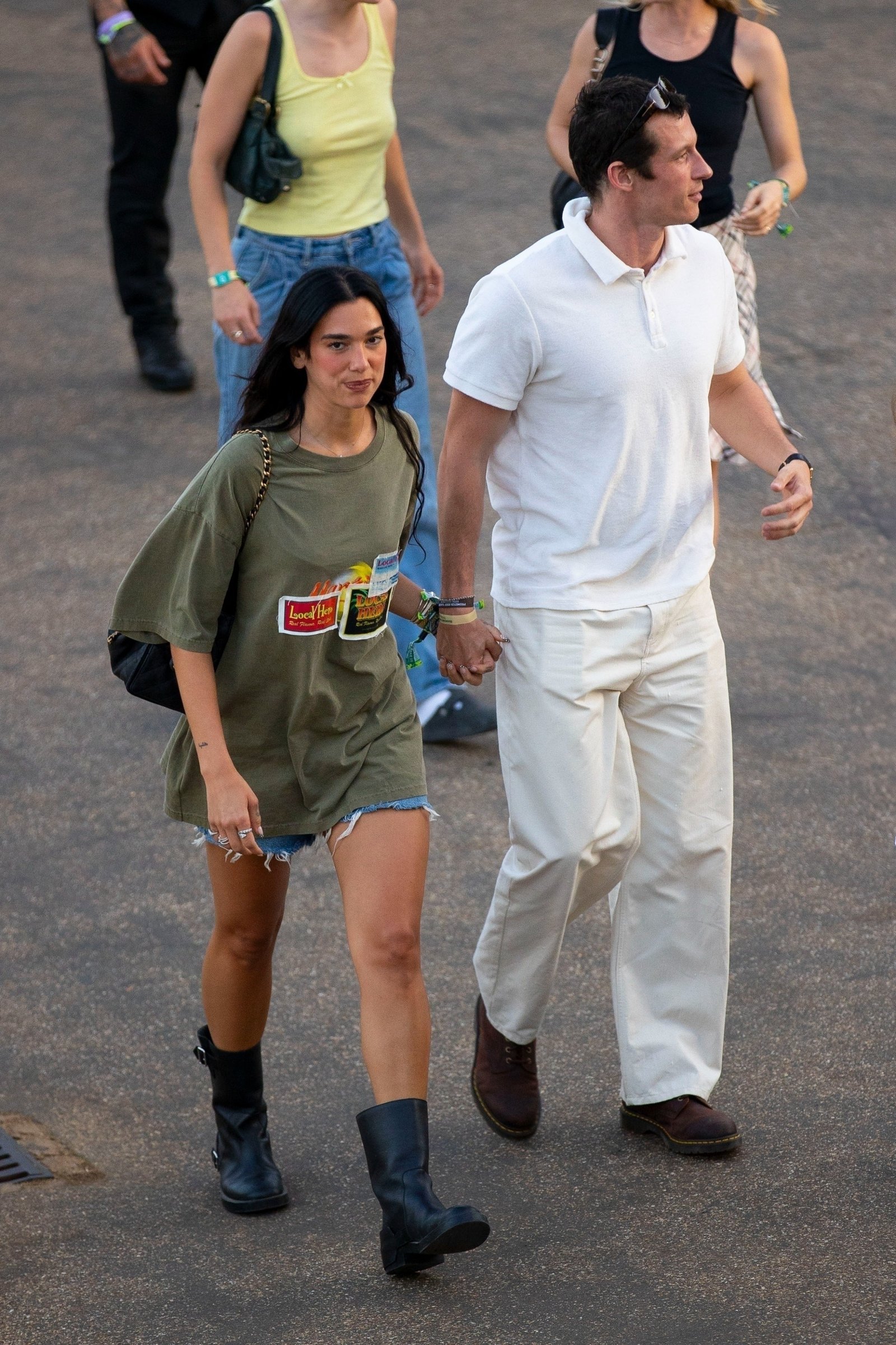 Dua Lipa wearing denim shorts with biker boots