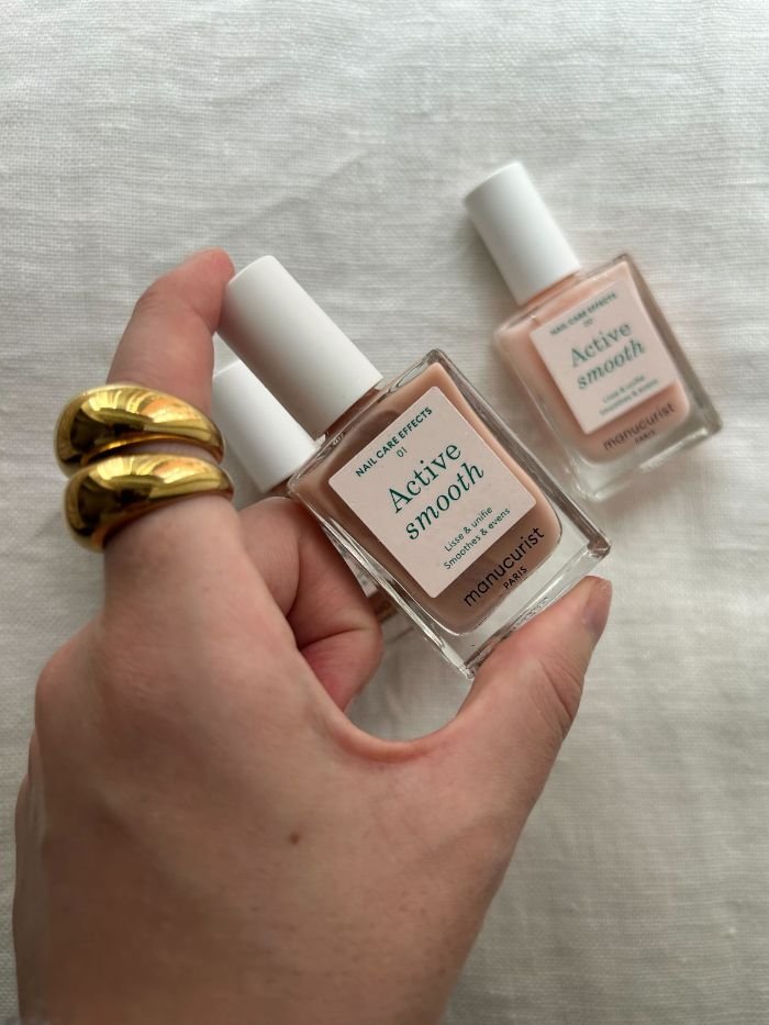 Junior beauty editor, Grace Lindsay, holding the Manucurist Active Smooth nail polish