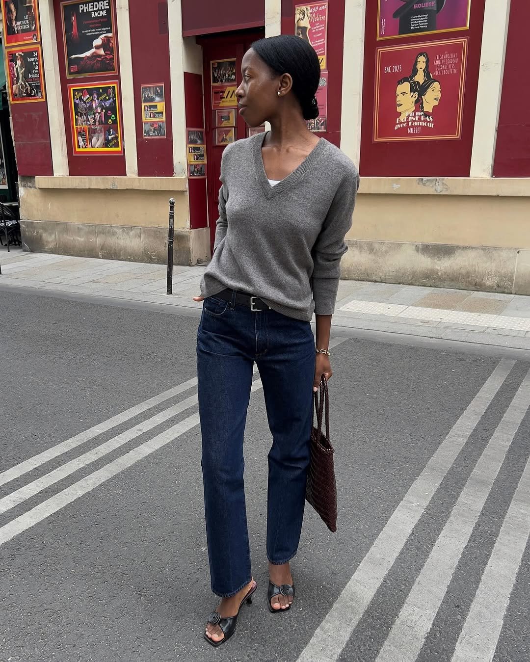 Woman wearing dark wash bootcut jeans fall 2025.