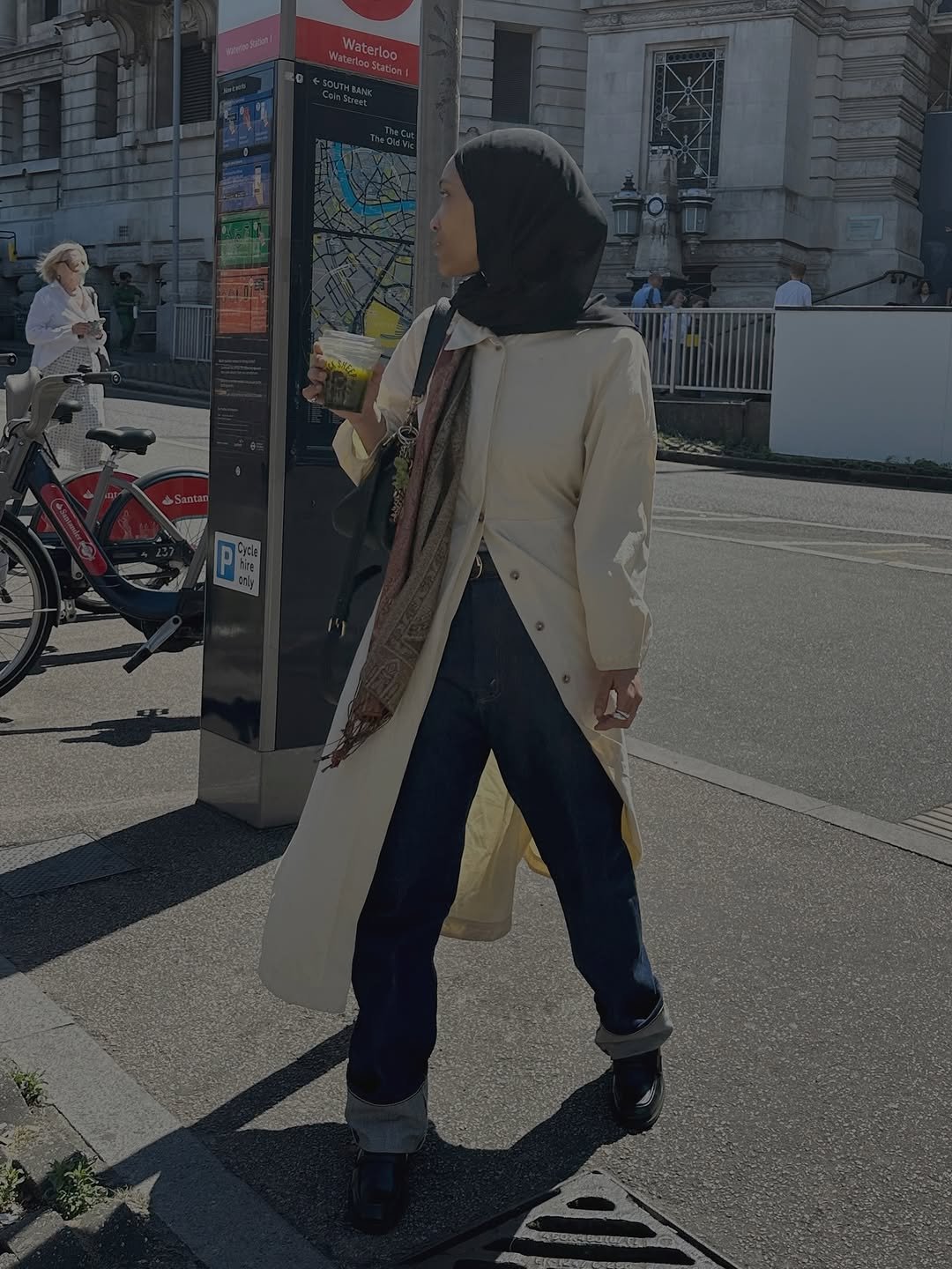 Woman wearing dark wash bootcut jeans fall 2025.