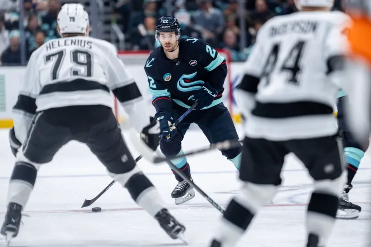 Jan 18, 2025; Seattle, Washington, USA; Seattle Kraken forward Oliver Bjorkstrand (22) skates with the puck during the second period against the Los Angeles Kings at Climate Pledge Arena. Mandatory Credit: Stephen Brashear-Imagn Images