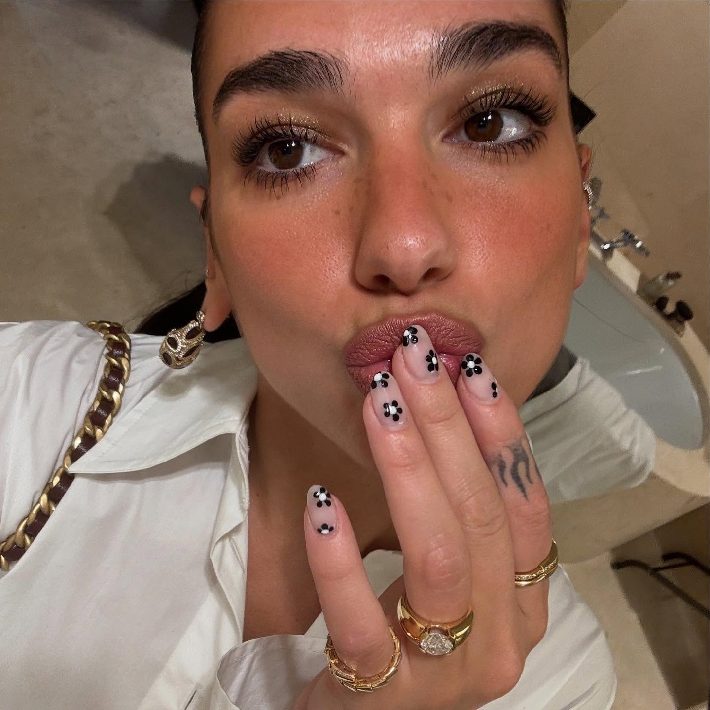 Photo of Dua Lipa wearing tuxedo nails