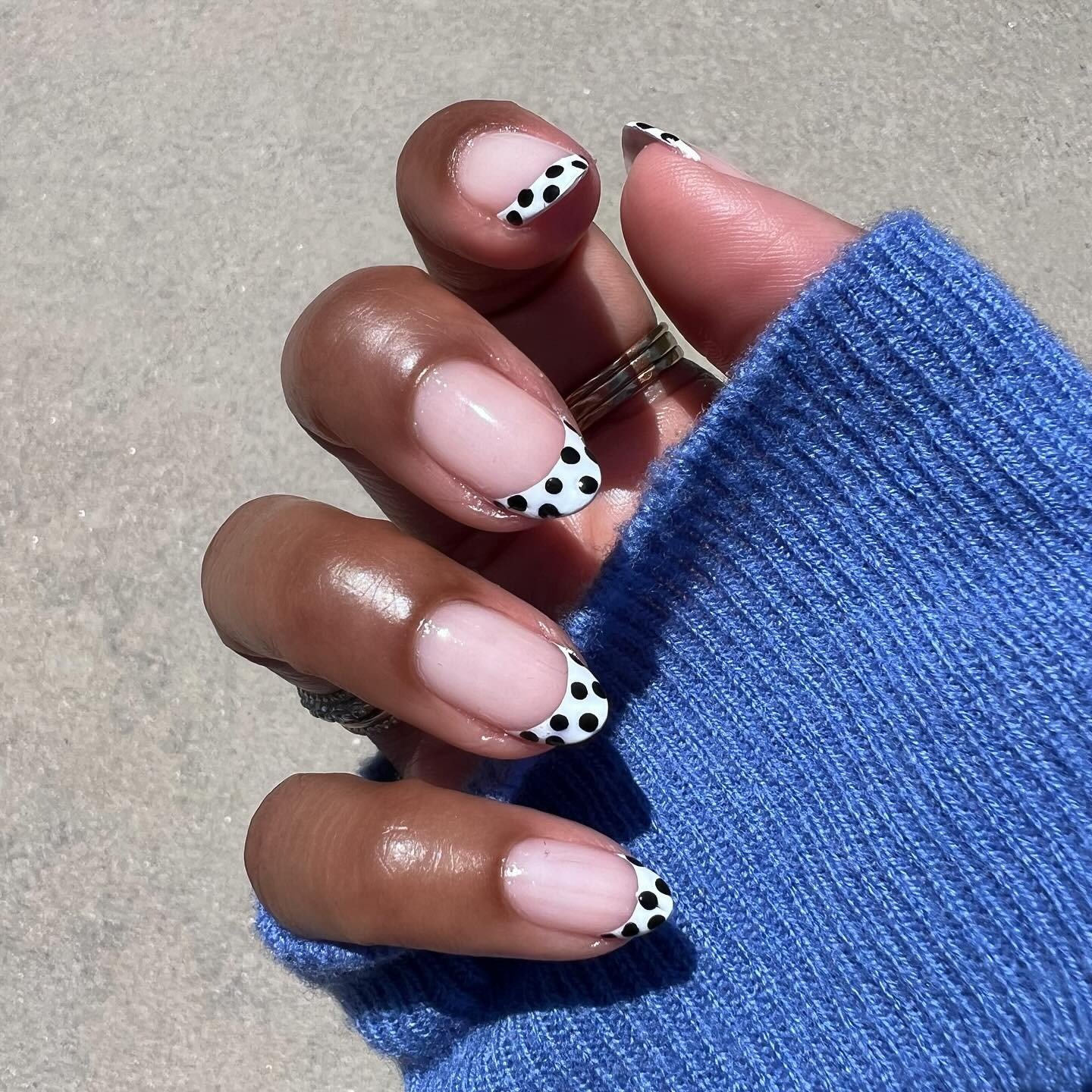 Photo of @themaniclub wearing tuxedo nails