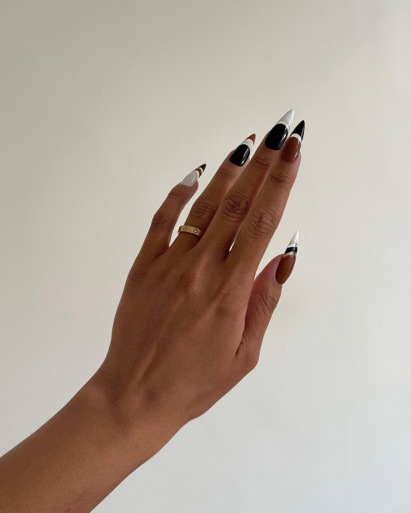 Photo of @iramshelton wearing tuxedo nails