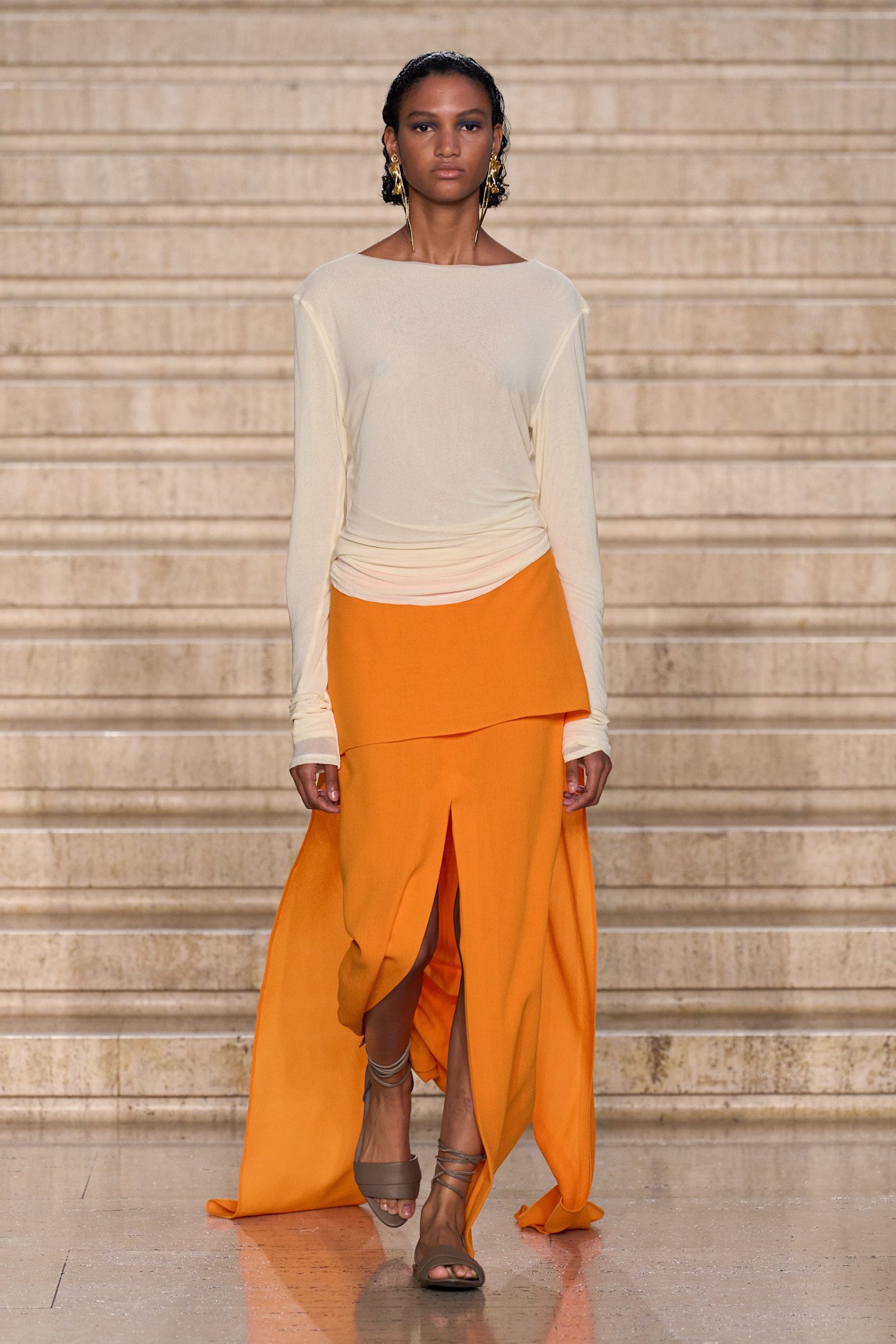 Photos from the Spring Summer 2026 runway showcasing orange color trend.
