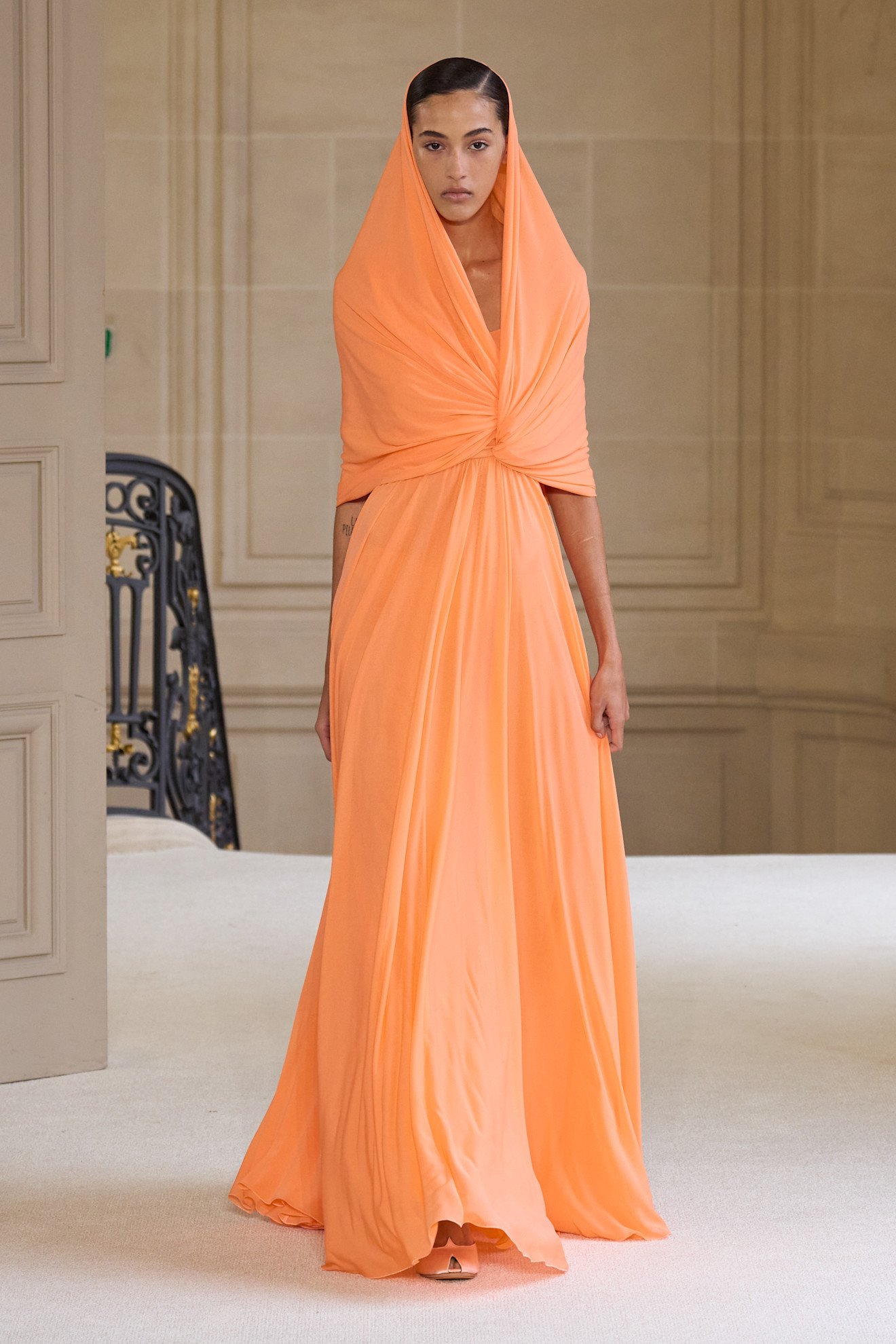 Photos from the Spring Summer 2026 runway showcasing orange color trend.