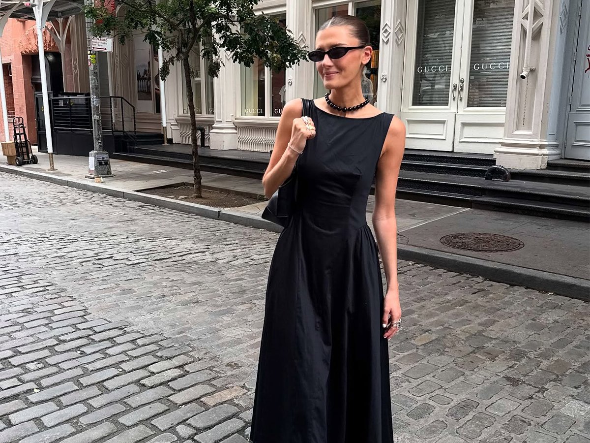 Influencer Coco Schiffer wears a black midi boatneck dress with black thong kitten heels.