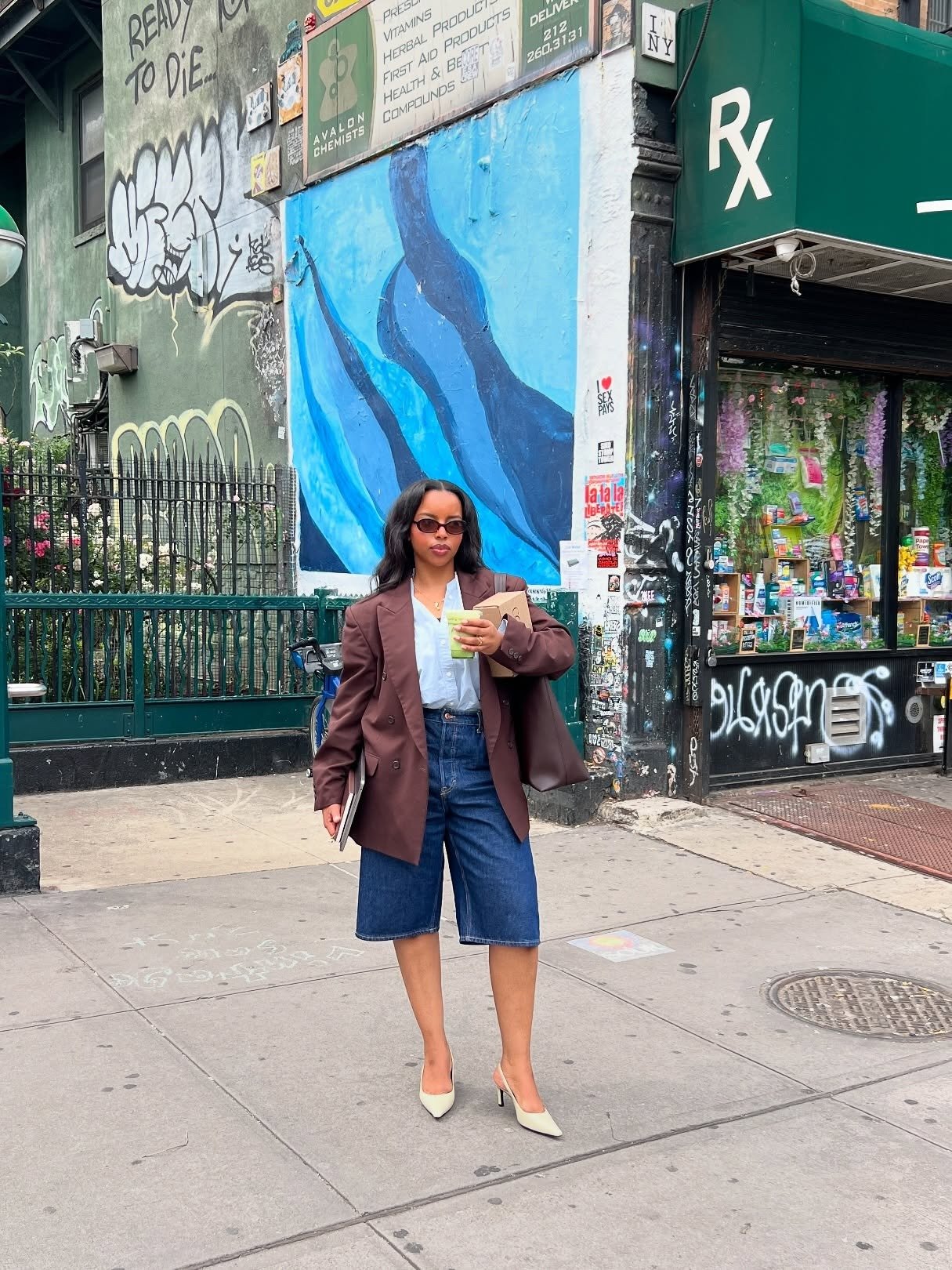 Influencer wearing long denim shorts with a blazer and pumps