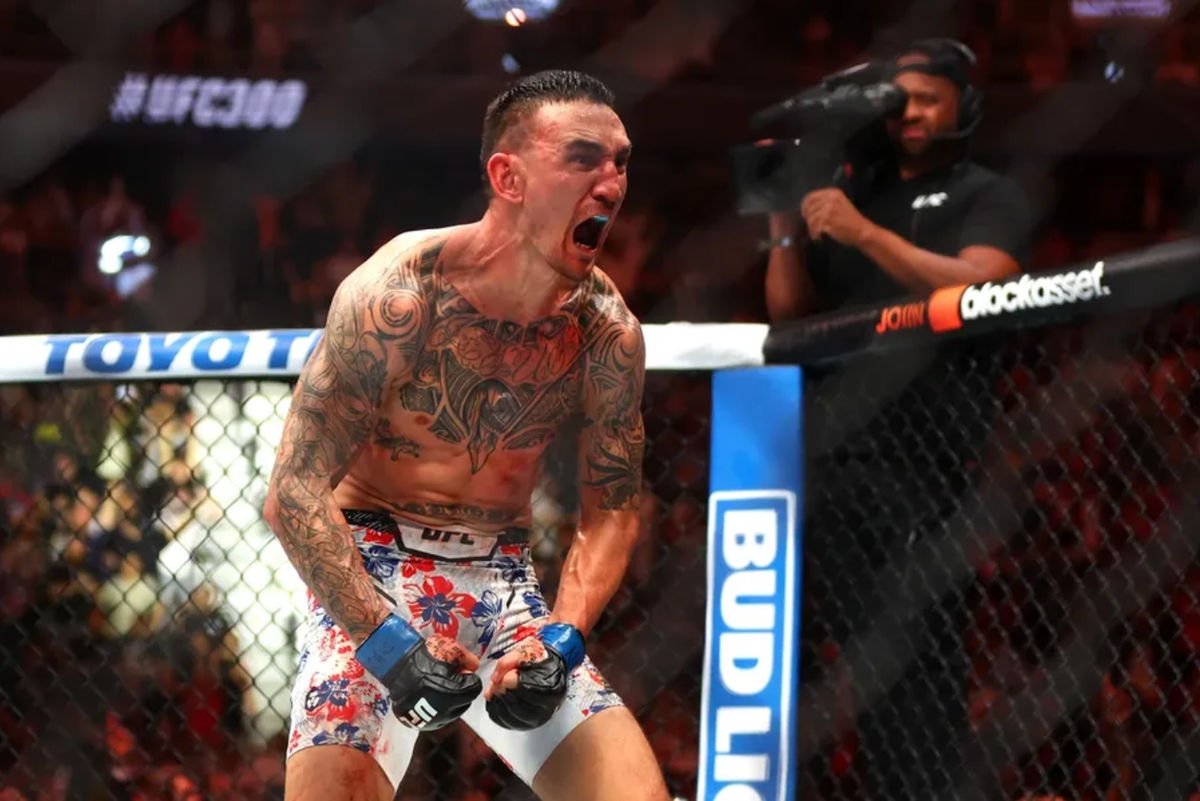 Apr 13, 2024; Las Vegas, Nevada, USA; Max Holloway (blue gloves) reacts after defeating Justin Gaethje (not pictured) during UFC 300 at T-Mobile Arena. Mandatory Credit: Mark J. Rebilas-Imagn Images