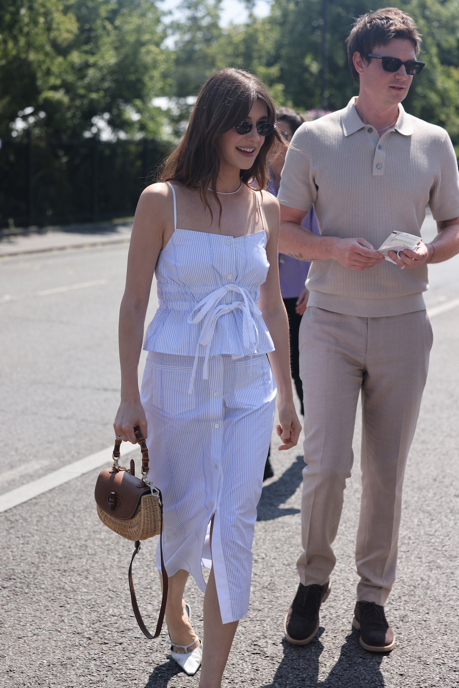 Daisy Edgar Jones wears a pinstripe co-ord with sunglasses at Wimbledon.