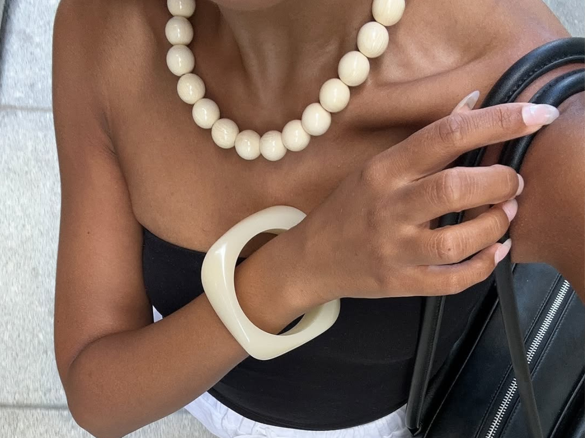 Woman wearing bangle bracelets jewelry trend 2025.