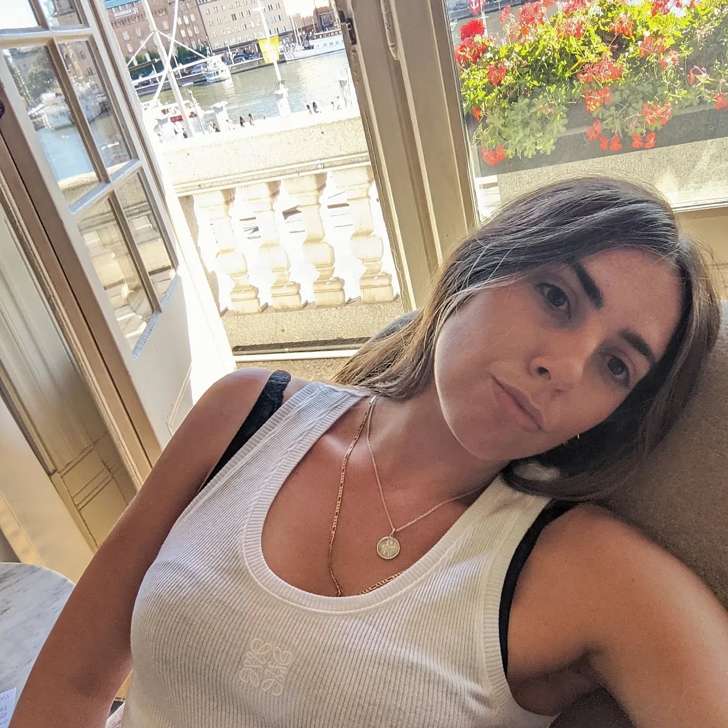 An image of Who What Wear's Shannon Lawlor wearing a Loewe white tank top.