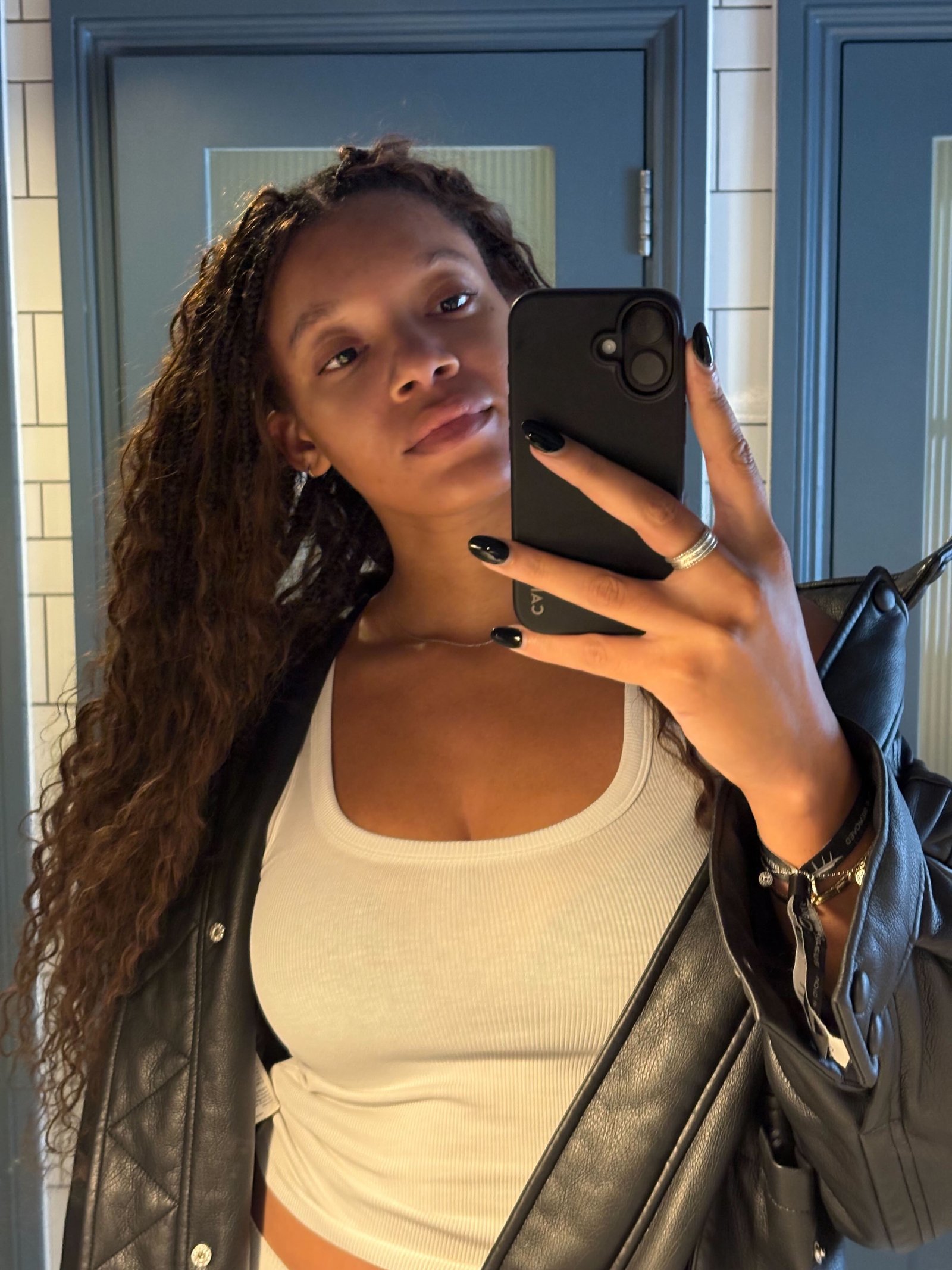 An image of a Skims Tank Top on Who What Wear's Imani-Nia Francis-Tsolaki.
