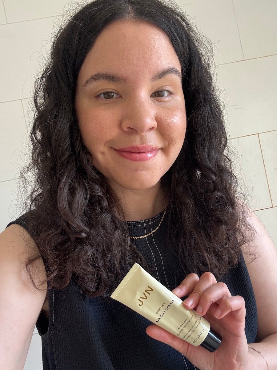 Mica Ricketts holding JVN Air Dry Cream