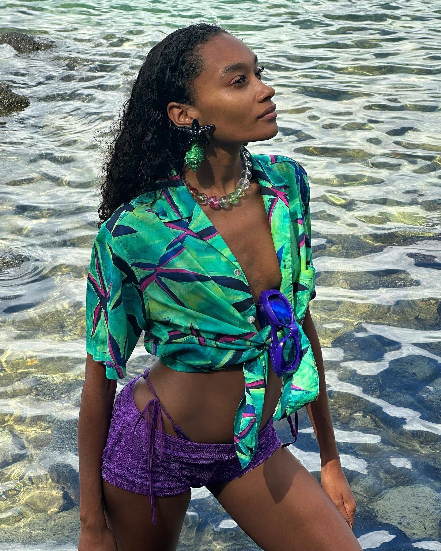 A woman posing in the water.