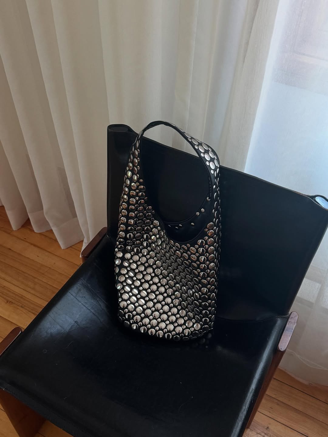 a Dotthz studded handbag