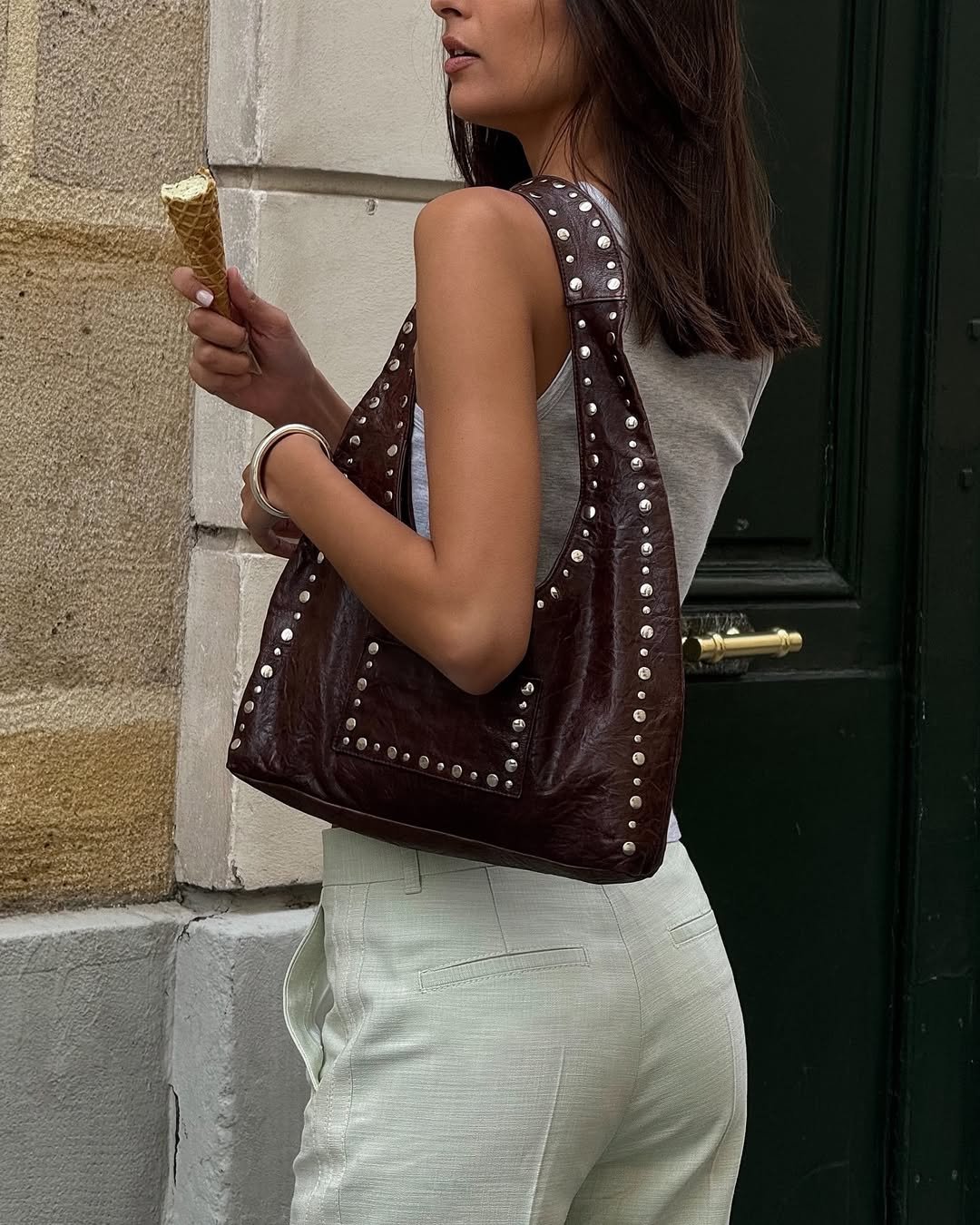 Salome Mory wearing a studded shoulder bag