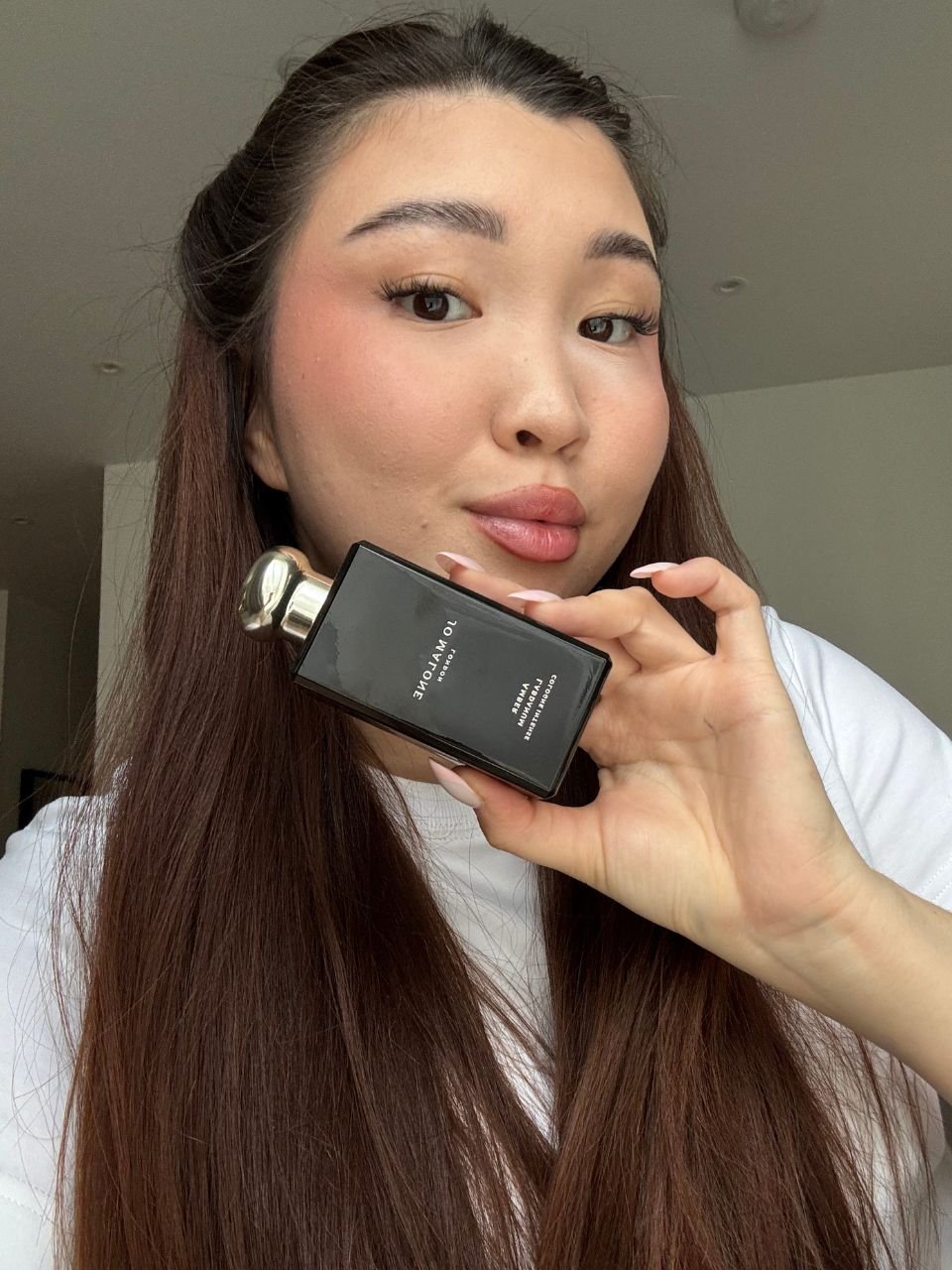 Denise Primbet testing the Amber Labdanum Cologne by Jo Malone London