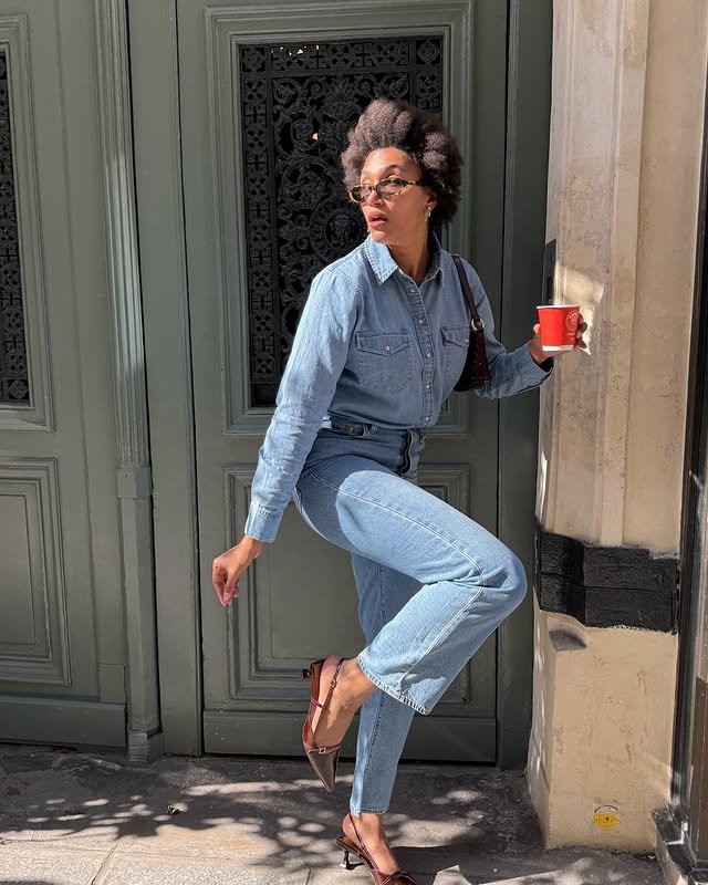 @lenafarl wears blue straight-leg jeans with a blue denim shirt and burgundy slingbacks