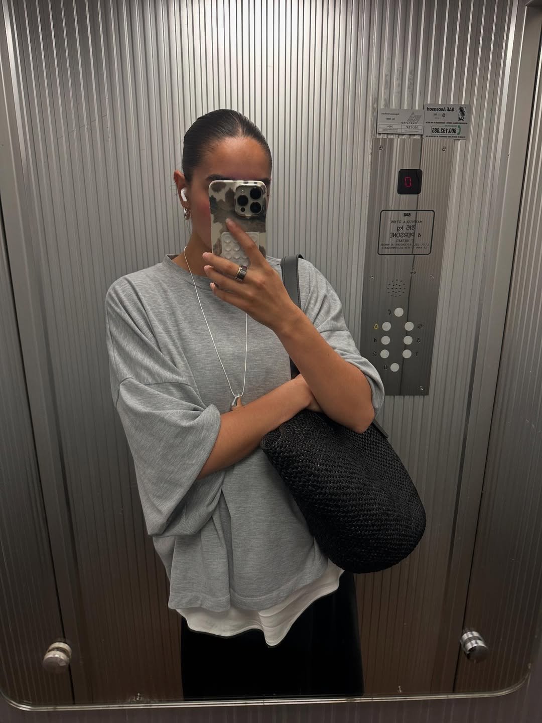 Selena Mual wearing layered T-shirts